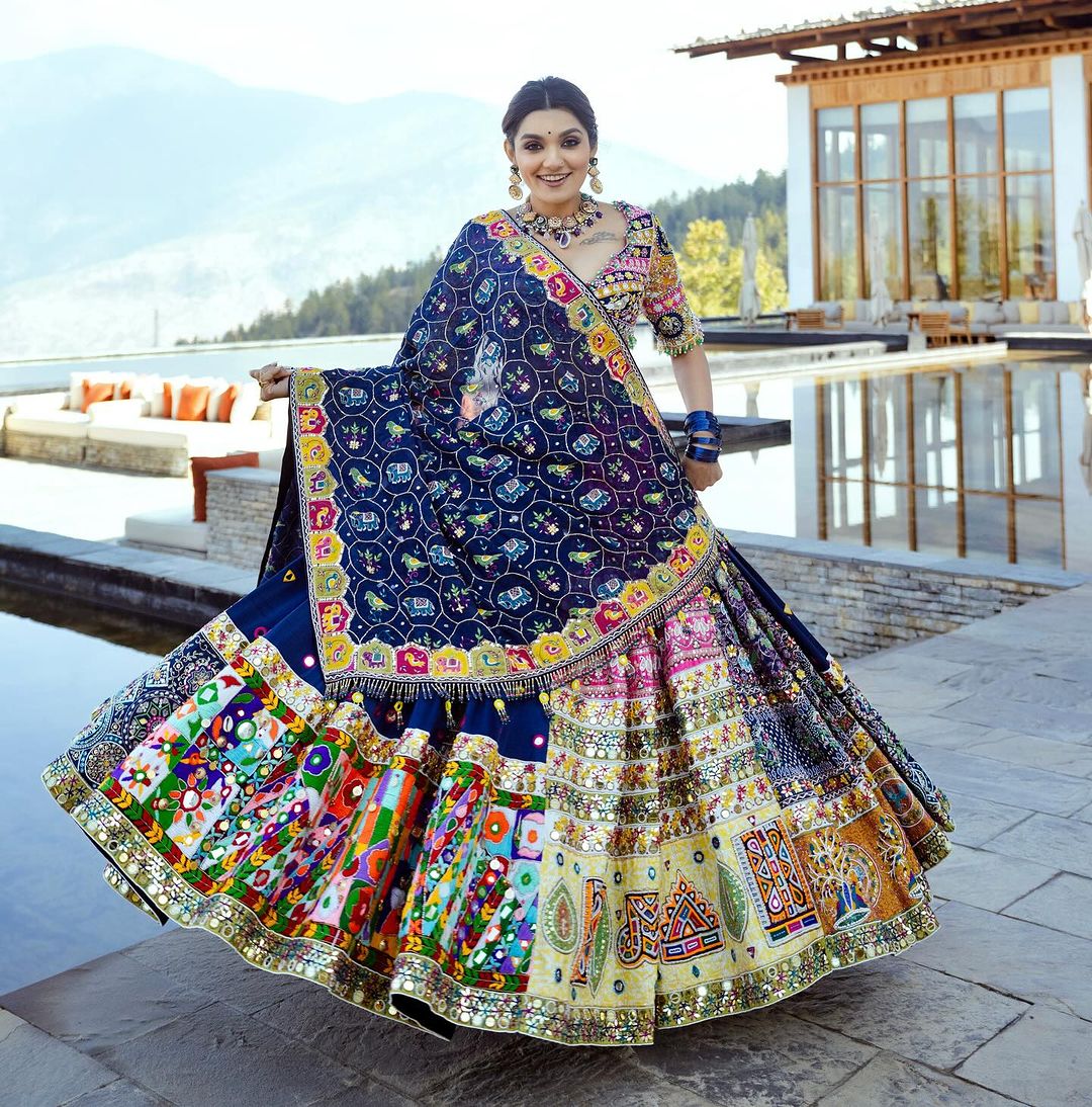 The only way to describe your navratri night classy is by wearing this Blue Color Lehenga With Real Mirror Work