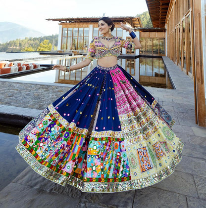 The only way to describe your navratri night classy is by wearing this Blue Color Lehenga With Real Mirror Work