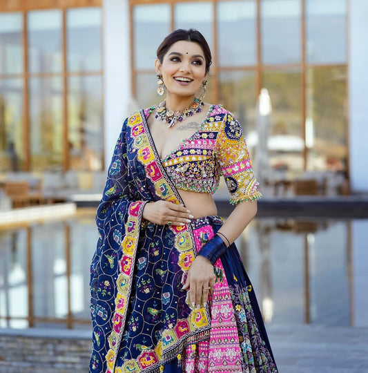 The only way to describe your navratri night classy is by wearing this Blue Color Lehenga With Real Mirror Work